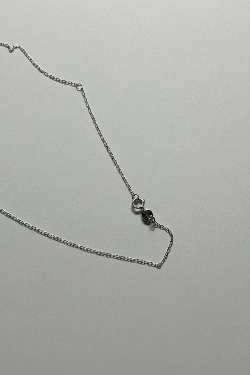 Close-up of 11-12mm Australian South Sea pearl mirror-like luster on Diana pendant cold white silver overtone_chain