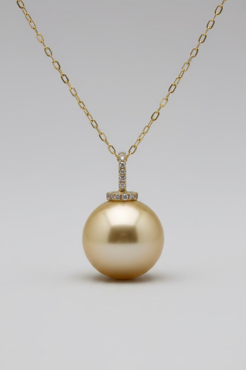 Close-up of 12-13mm golden South Sea pearl satiny luster warm champagne gold color with certificate
