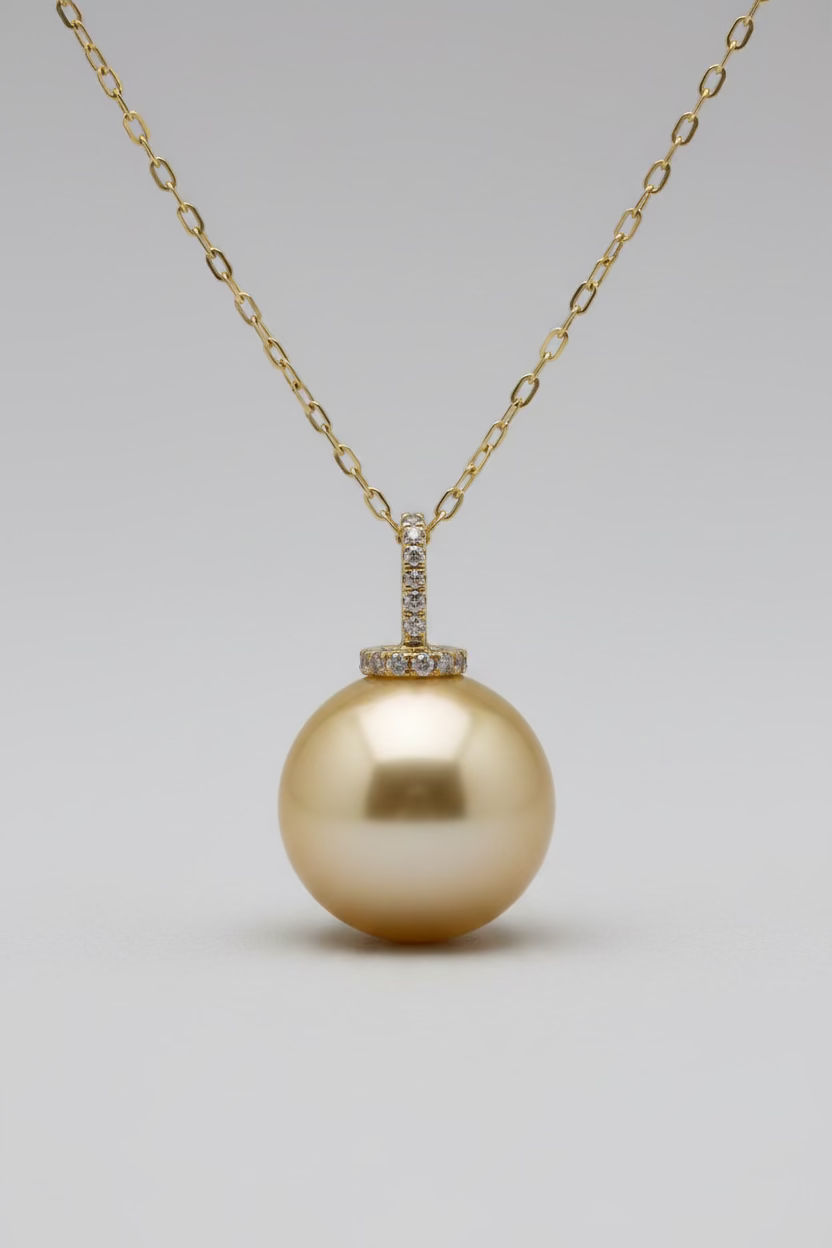 Close-up of 12-13mm golden South Sea pearl satiny luster warm champagne gold color with certificate
