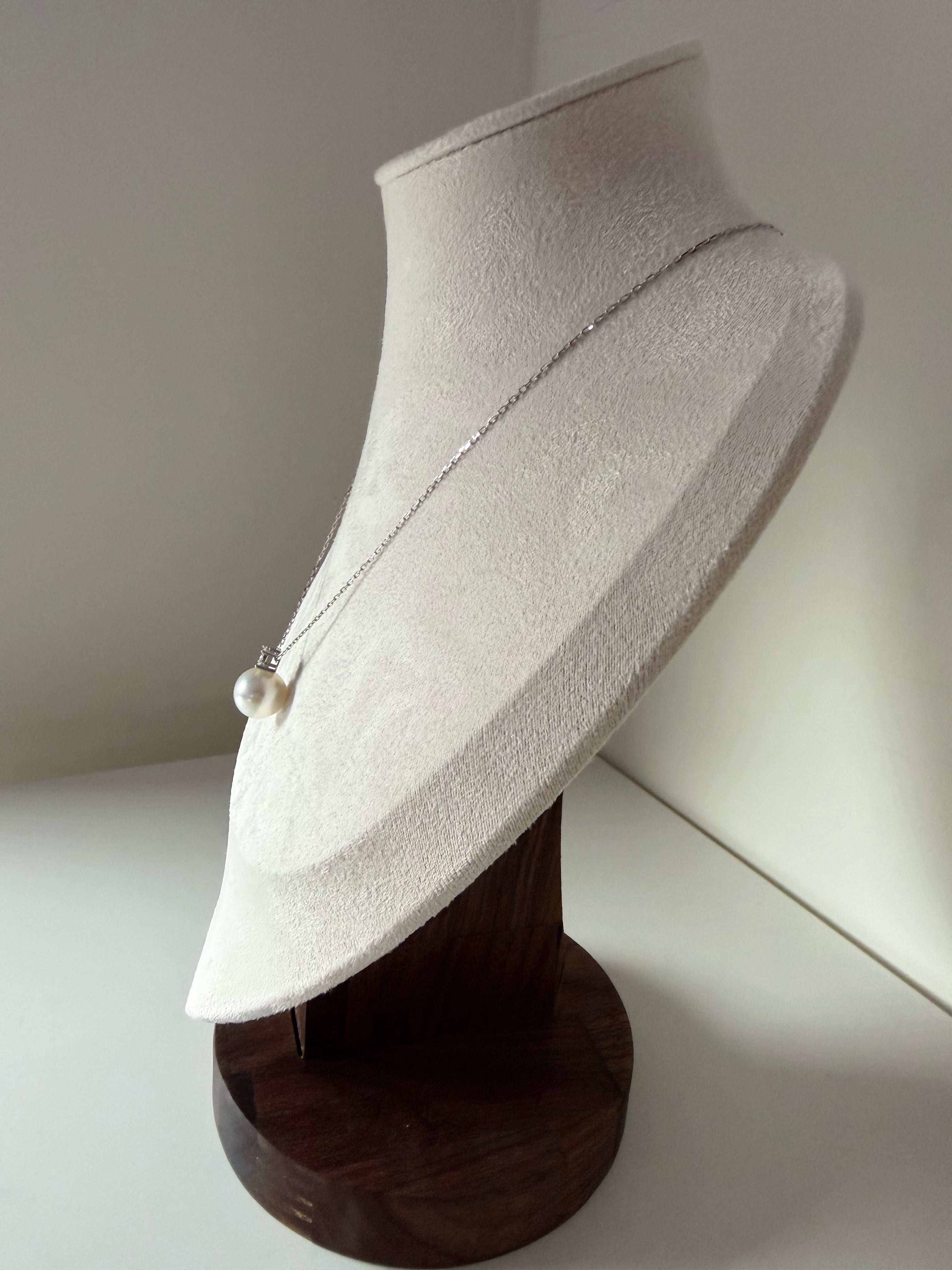 Side view of Diana pearl pendant on woman neck 11-12mm Australian white pearl classic elegance_mannequin