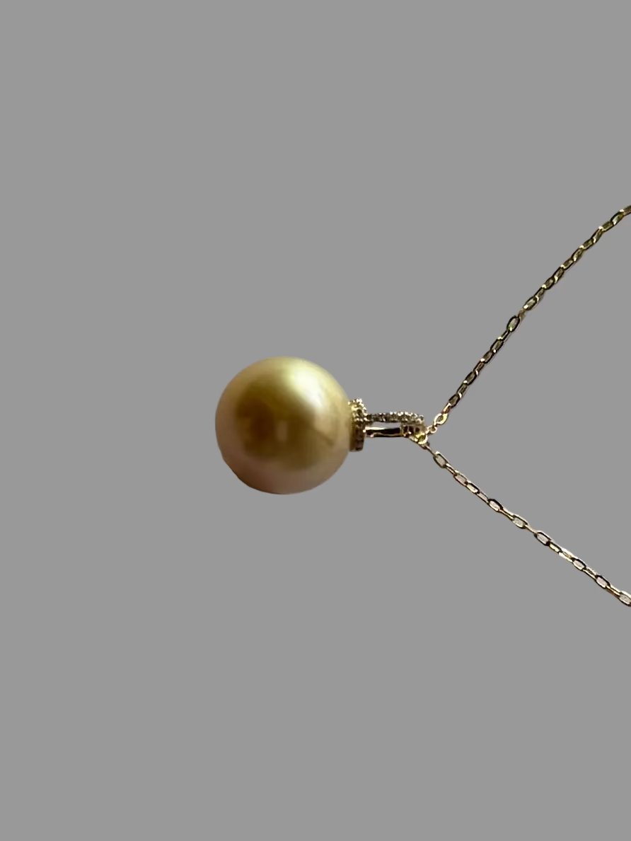 Side view of golden South Sea pearl pendant 12-13mm 18K gold minimalist setting_side