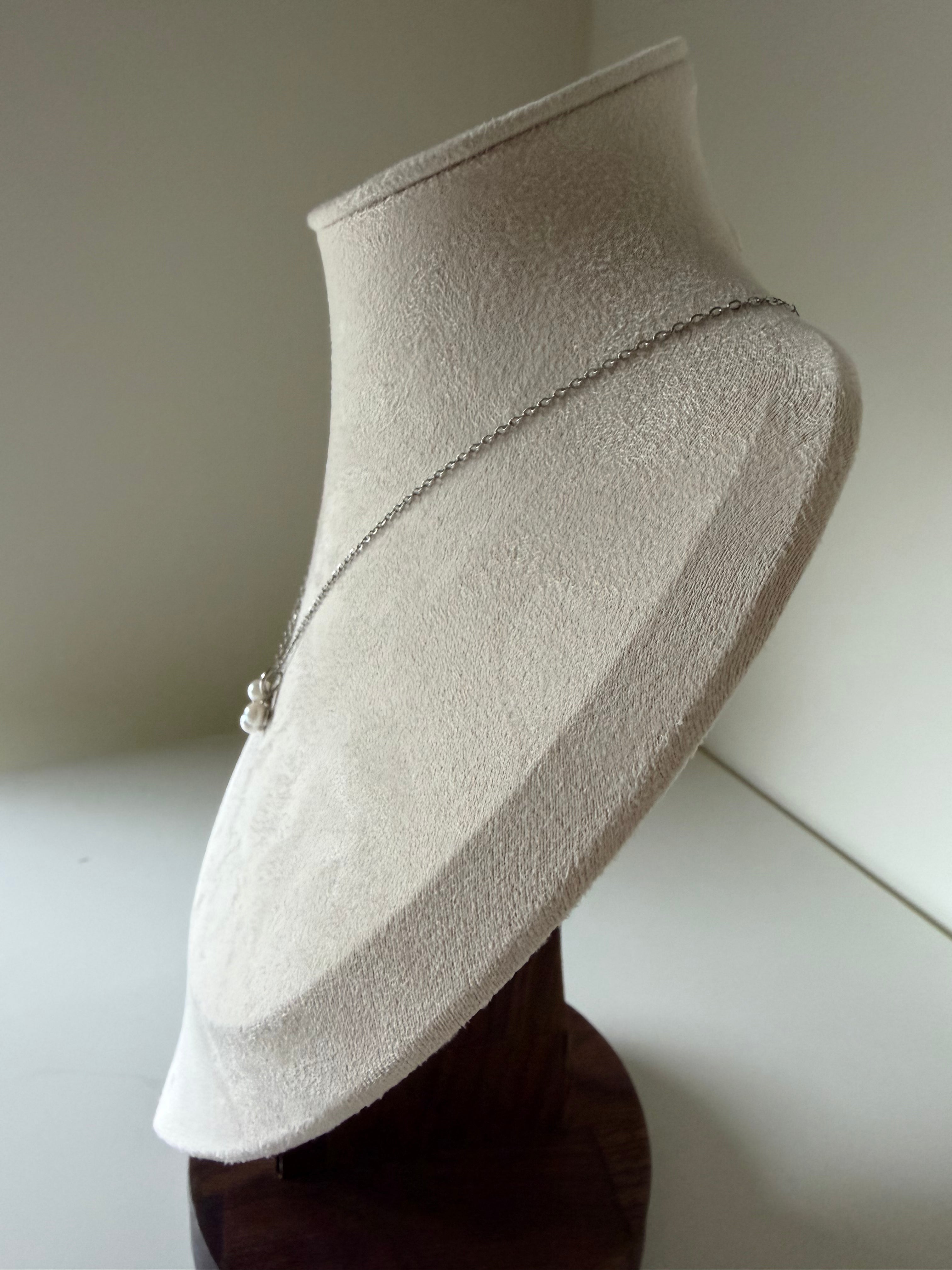 Side view of three leaf clover pearl pendant on woman neck 4.5mm Akoya pearls_mannequin